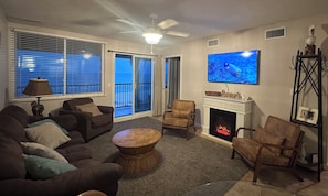 Living room with beautiful views from the flat screen TV & the beautiful ocean