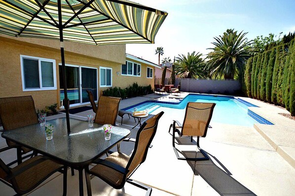 Large private pool and spa with BBQ, lounge chairs, patio table and gas fire pit