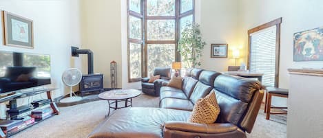 Living Room with plenty of seating, Leather couch, fireplace and TV