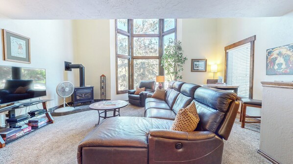 Living Room with plenty of seating, Leather couch, fireplace and TV