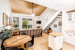 Open living area with high loft ceiling