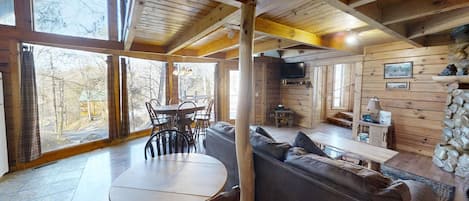 Once inside, you're welcomed with huge windows and all the accents of a Smoky Mountain cabin!