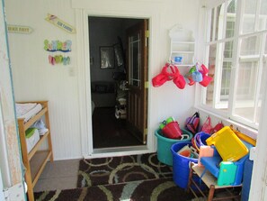 Sunroom with Changing Table, Stroller and Beach Chairs