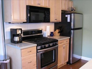 Well-equipped kitchen with many basics in pantry
