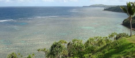 The view of Anini Beach and Kilauea Lighthouse from Kai Nani's covered lanai