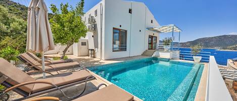 Sit back and relax around pool with amazing sea views