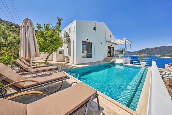 Sit back and relax around pool with amazing sea views