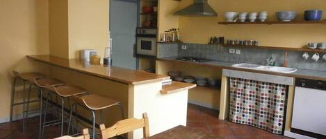 Bright and very spacious kitchen, perfect for cooking and eating altogether.