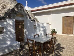 Front patio with moveable dining table and chairs.