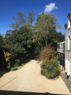 The park view from the apartment, parking out back behind the trees