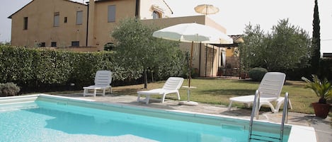 The pool in the private garden and patio