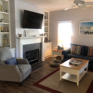 Living room with large screen TV and comfy recliner
