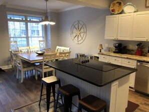 Updated kitchen with large island and breakfast bar seating
