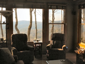 2 swivel/rocker/recliner chairs allow for watching TV, or the big view outside.