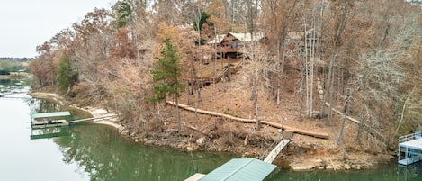 view of private dock and walkway from house