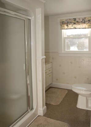 Bathroom with walk in shower.