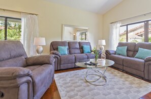 Living Room with 4 recliners  sliding doors to the pool and backyard   watch tv
