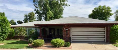 Front of house with 2 car garage.