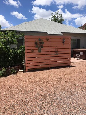 Privacy wall and parking area.
