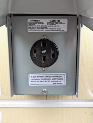 Type 2 electric charging station available on adjacent property. Bring own cord.