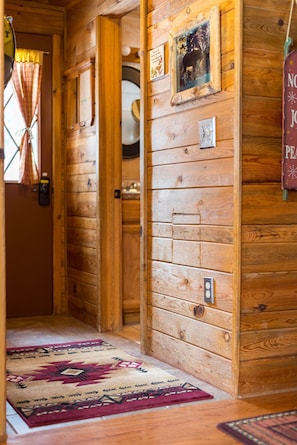 Short entrance hall.  Door on the right is the bathroom.
