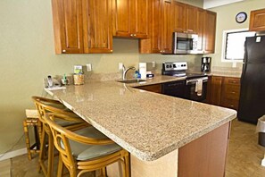 Recently remodeled kitchen with granite counters and great view of the ocean