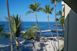 View from lanai looking north above the beach below