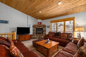 Living room with gas fireplace and TV