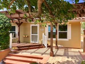 Front entrance with avocado trees providing shade. 