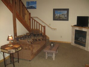 Living room with fireplace, sofa bed, TV with cable and DVD, WiFi included