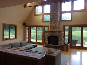 The great room with wonderful water views and working fireplace