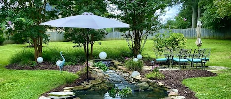 Koi pond, babbling brook and outdoor dining area.