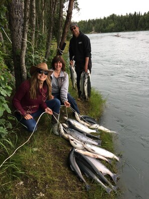 At the cleaning station, after catching sockeye salmon from our private bank.