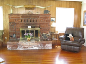 fireplace and oversized recliner in living room