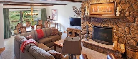 Beautiful living room with wood burning fireplace.