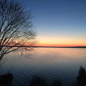 Enjoy the sun rise.  Our Cottage is located on the East Side of Burt Lake