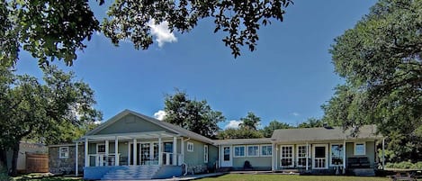 View of lakehouse from front yard next to water