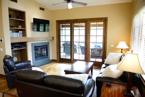 Living area, leather sofa, loveseat, and chair