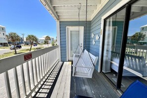 Porch swing and seating on your private balcony.  The perfect spot to have some quiet time in the morning or unwind after a fun-filled day in the evening.