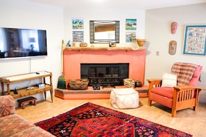 art filled, sitting room,  Smart TV, Couch, recliner, cork flooring