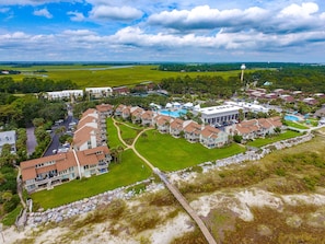 Aerial View from the beach looking back at the John Fripp Villas and The Beach Club pools