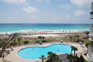 view of the pool and ocean from the balcony