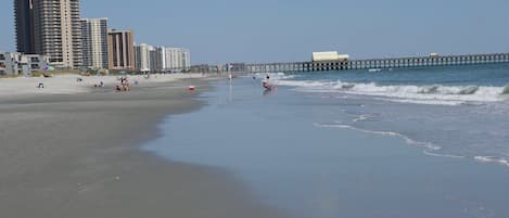 View walking north along the beach towards the Apache pier