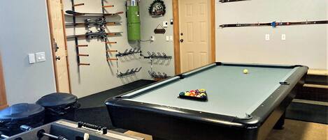 Basement games room with pool and foosball