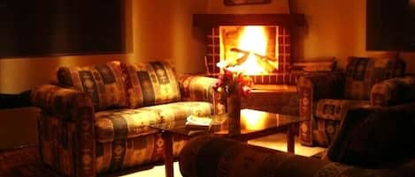 Living room with fireplace and hardwood floors