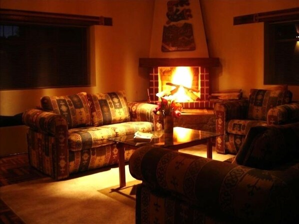 Living room with fireplace and hardwood floors
