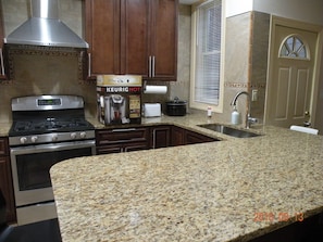 Closeup of Kitchen with granite countertop.