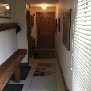 Front hallway, with hooks and cubbies for everyone's gloves and boots