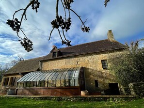 Glasshouse with Dining table.
