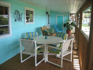 Back porch with swing, over looks large back yard and dock 